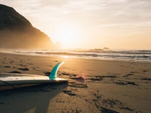 Surfboard on a beach in the sunset