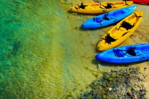 yellow and blue kayaks on water